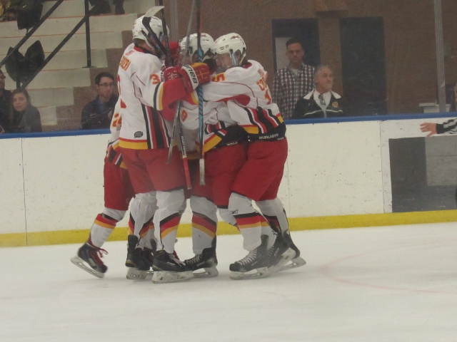 The Chaminade Flyers celebrate a goal by Trevor Radin (Photo by Gregory Giaconelli) 