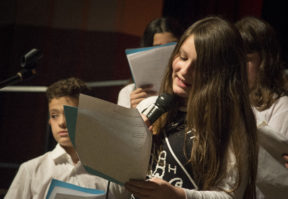 Alexa Valic, a seventh grader at South Middle School, read quotes from "Wonder" before an auditorium of parents. 