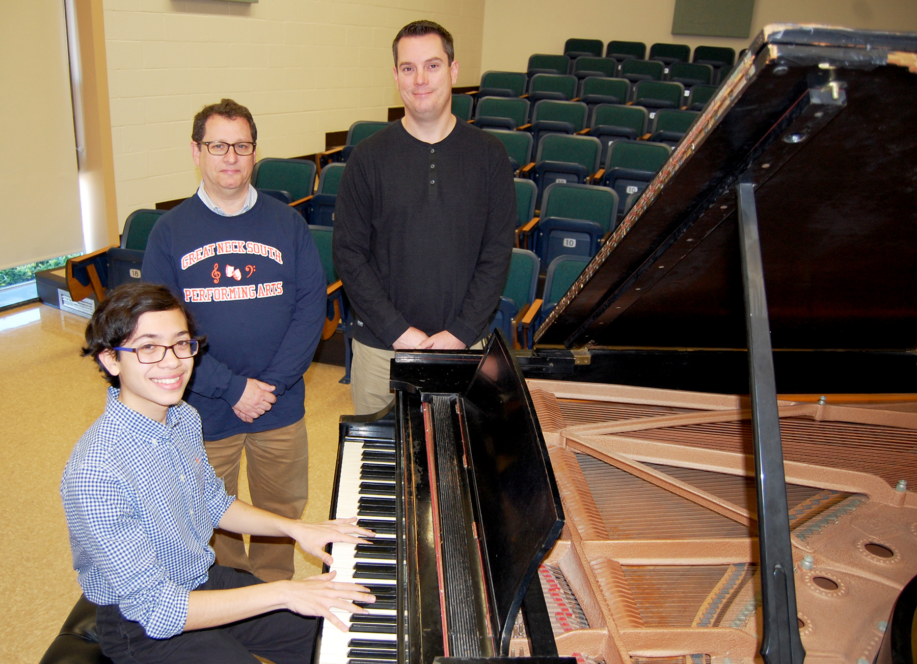 Benjamin T. Rossen is congratulated by Mr. Michael Schwartz, performing arts department head, and Mr. Mark Boschen, instrumental music teacher at South High. (Photo courtesy of Great Neck Public Schools)