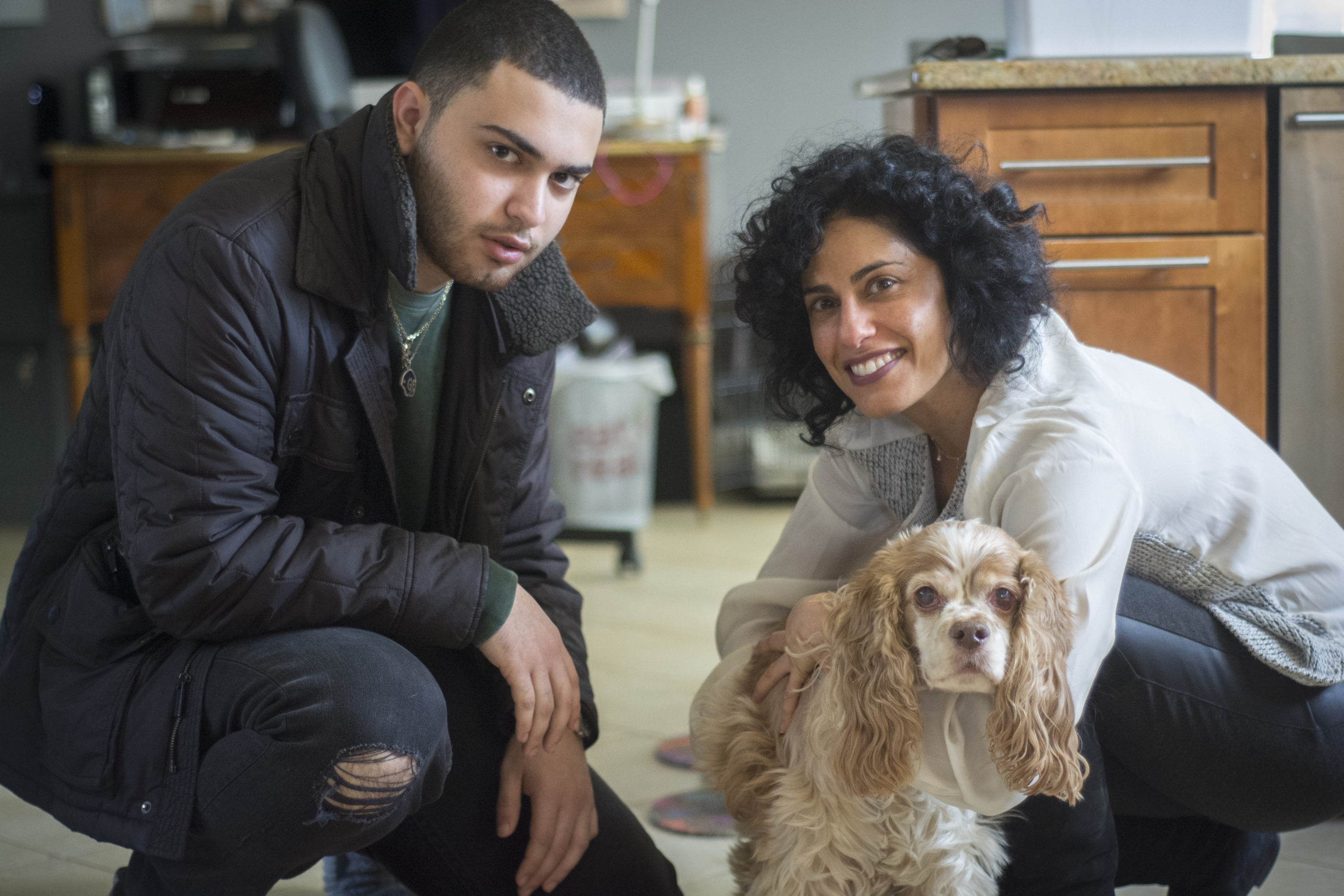 Flynn, a 13-year-old four legged resident of Great Neck Estates, poses with his owner Dahlia Abraham Klein and her son, Jonah Hersh. (Photo by Janelle Clausen)