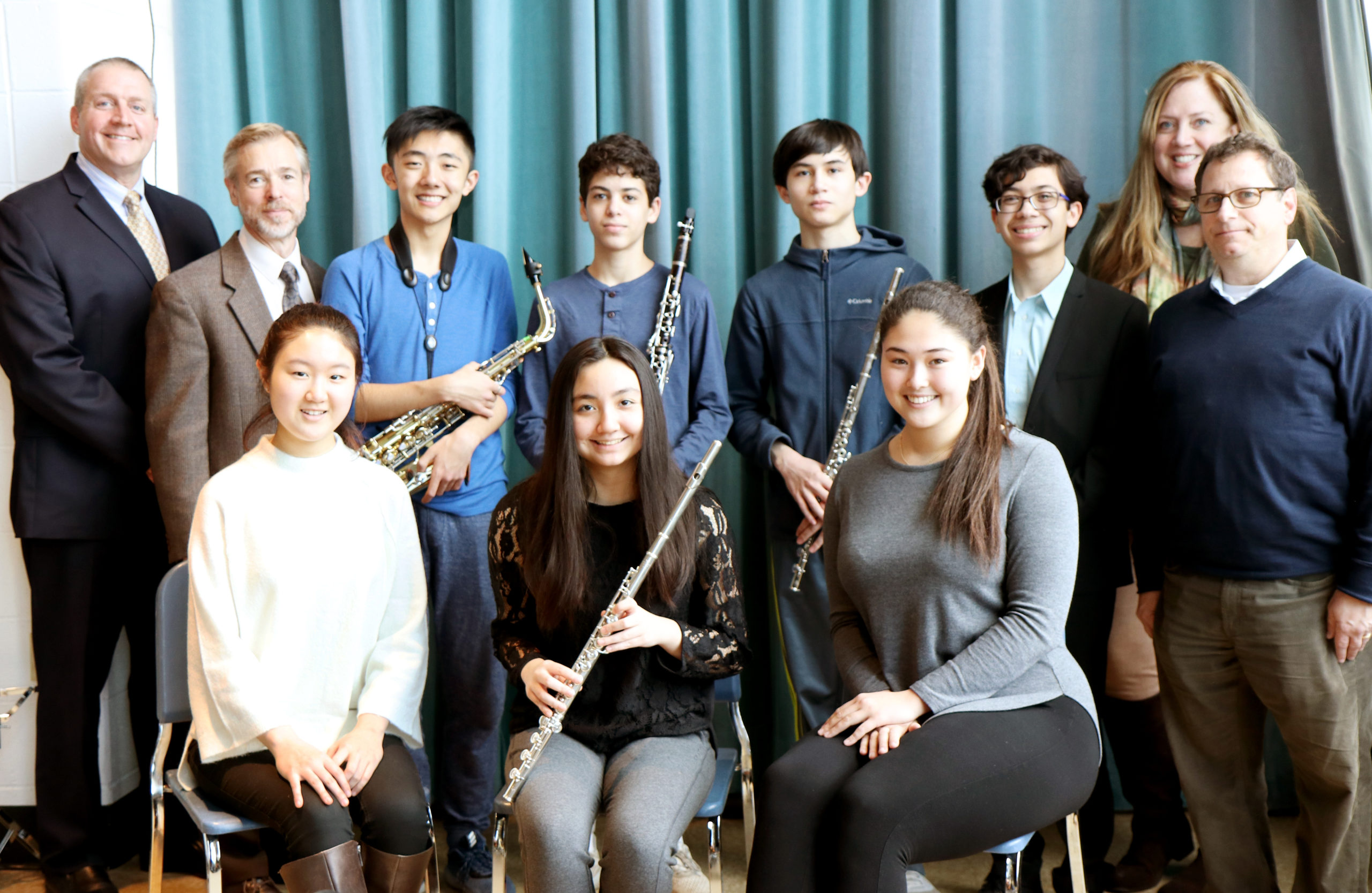 Great Neck South High School musicians Soyoung Park, Christiana Claus, Susan Fendt, Andersen Gu, Eli Goldberger, Samuel Levine, and Benjamin T. Rossen are congratulated by Principal Dr. Christopher Gitz, English Department Chair Dr. David Manuel, Vocal Music Instructor Dr. Jeanine Robinson, and Music Department Chair Michael Schwartz. (Photo courtesy of Great Neck Public Schools)