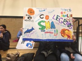 Silverstein Hebrew Academy Girls Basketball Lady Sharks supporters hold colorful signs celebrating the team during their recent championship game. The Lady Sharks won the championship 45 to 39, defeating all other teams in their Yeshivot division. (Photo courtesy of Silverstein Hebrew Academy)