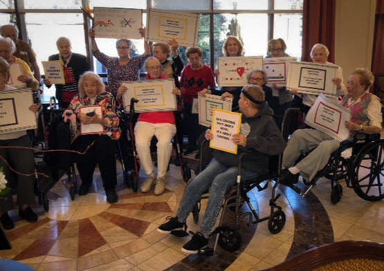 Around 30 people at Atria Cutter Mill created their own 'March for Our Lives' demonstration to stand with Marjory Stoneman Douglas High School students who survived a mass shooting and are pushing Congress to take action to curtail violence. (Photo courtesy of Edna Pitashnick)