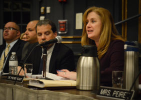 Superintendent of Schools Teresa Prendergast addresses parents at a Monday night board meeting, along with security and building administrators. (Photo by Janelle Clausen)