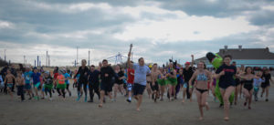 The Town of Oyster Bay held their 5th annual polar plunge this year, with people from all over Long Island charging into the icy waters of Tobay Beach. (Photo by Janelle Clausen)