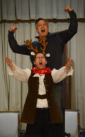 Jon Kaiman, the former town supervisor of North Hempstead, and Mark Putter, one of the show producers, belt out a musical number as Gaston and Lefou. (Photo by Janelle Clausen)