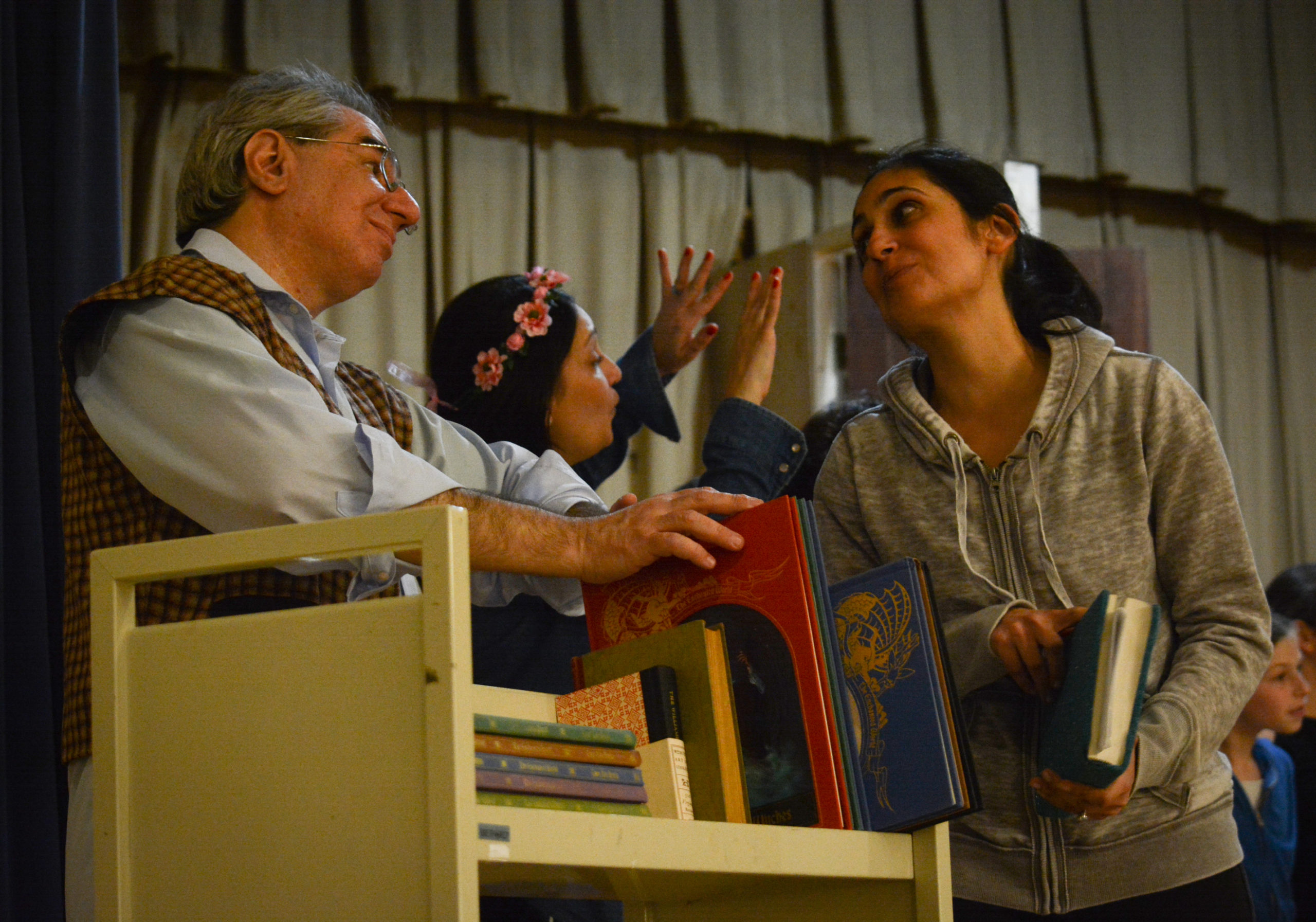 Lillian Rokhsar and Robert Aizer, rehearsing their respective roles of Belle and bookseller, will appear in Temple Israel's upcoming performance of Beauty and the Beast. (Photo by Janelle Clausen)