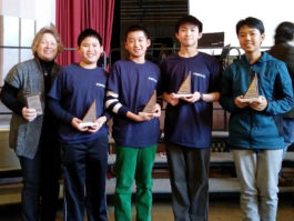Four South Middle students receive their second-place trophies. (Photo courtesy of the Great Neck Public Schools)