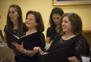 Ann Hirsh and Sherry Husney smile as they perform with their peers at a Shireinu Choir of Long Island rehearsal. (Photo by Janelle Clausen) 