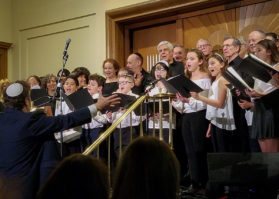 The Temple Israel Children's Choir, under the direction of Cantor Raphael Frieder, sings with the Shireinu Choir of Long Island. (Photo by Janelle Clausen)