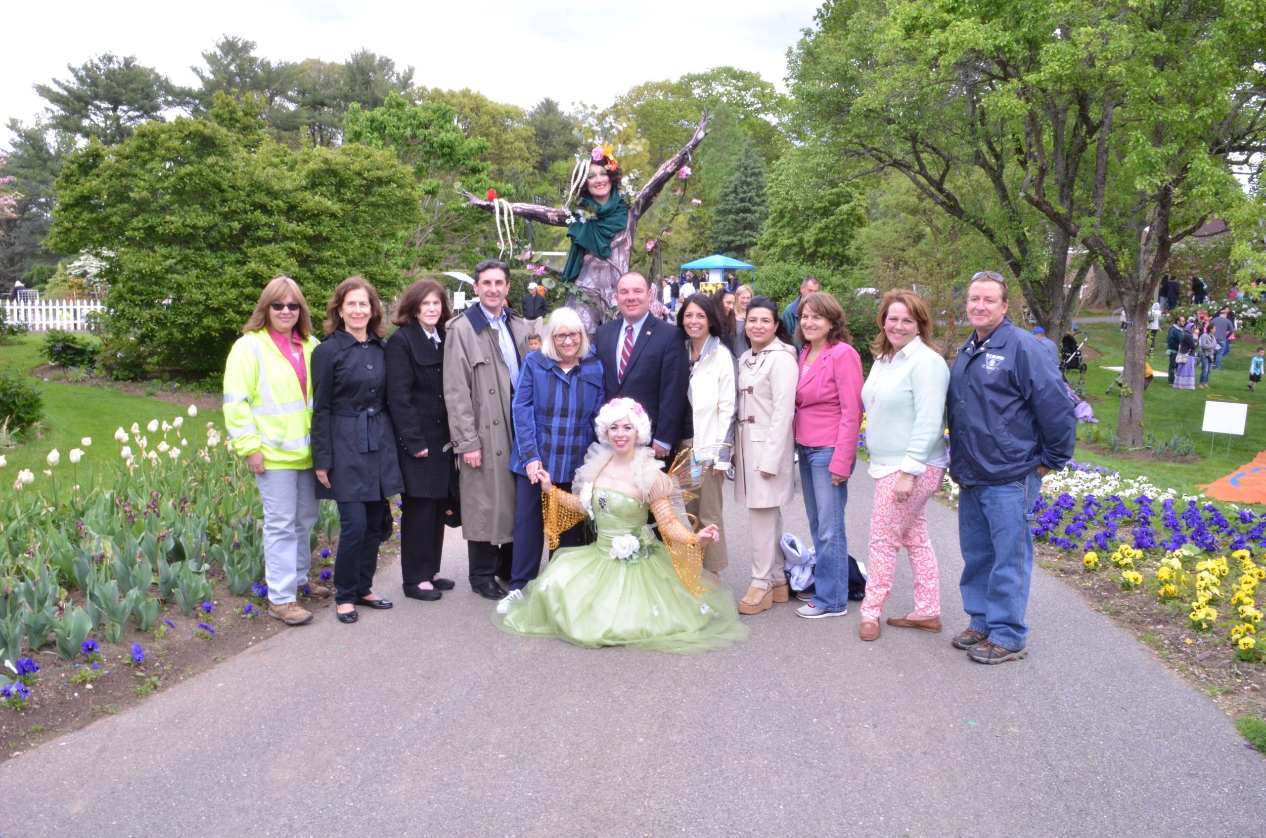 Fairies from the National Circus Project at the Clark Garden Spring Festival pose with local officials. (Photo courtesy of the Town of North Hempstead)