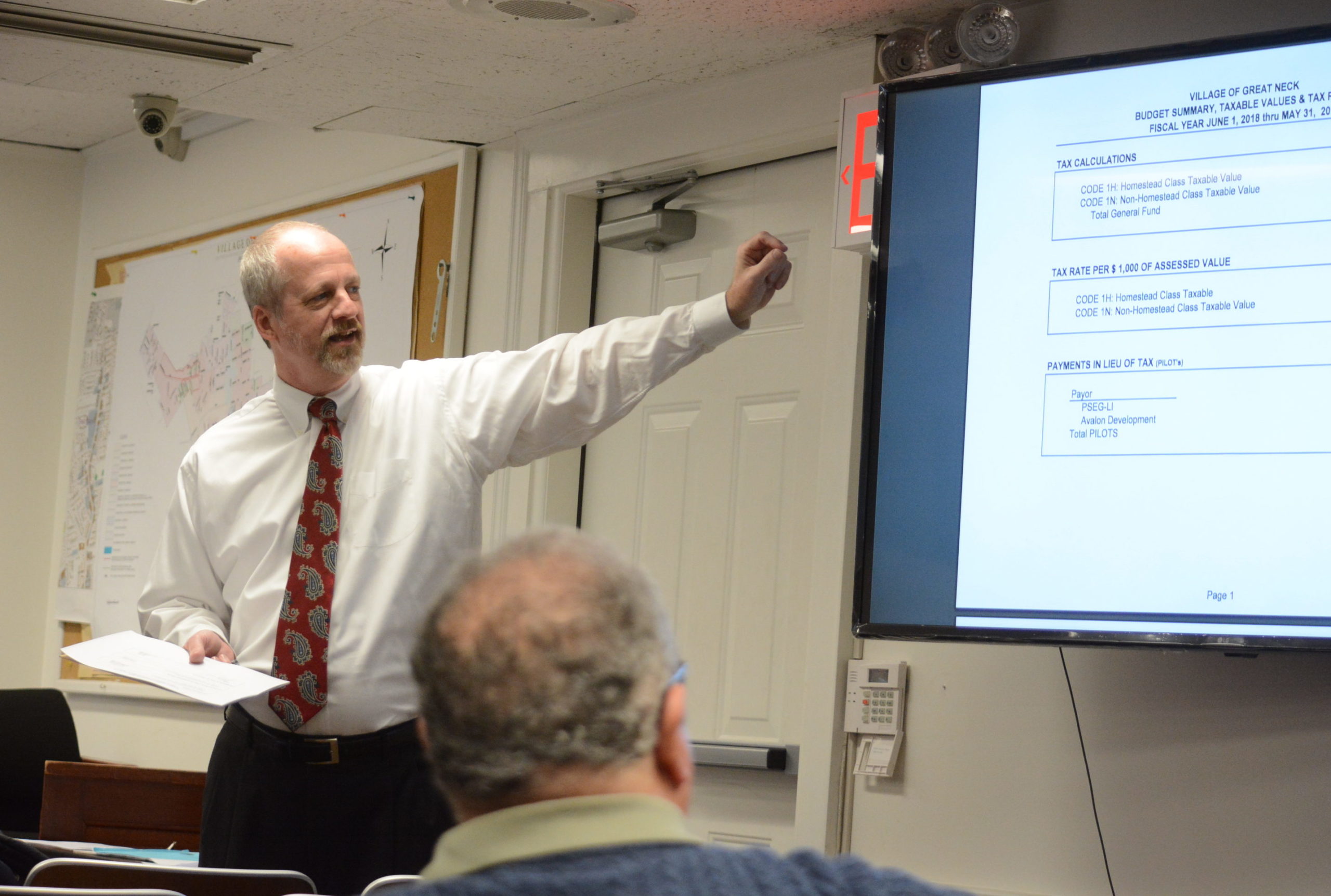 Village Clerk-Treasurer Joe Gill discusses the $9.67 million budget at a Tuesday night board meeting. (Photo by Janelle Clausen)