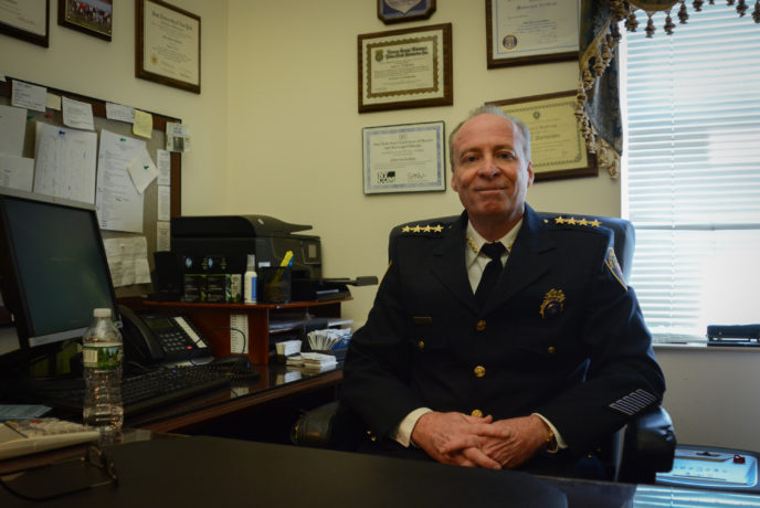 John Garbedian, who has served as the Great Neck Estates Police Chief for more than 10 years, sits in his office one last time before his retirement. (Photo by Janelle Clausen)