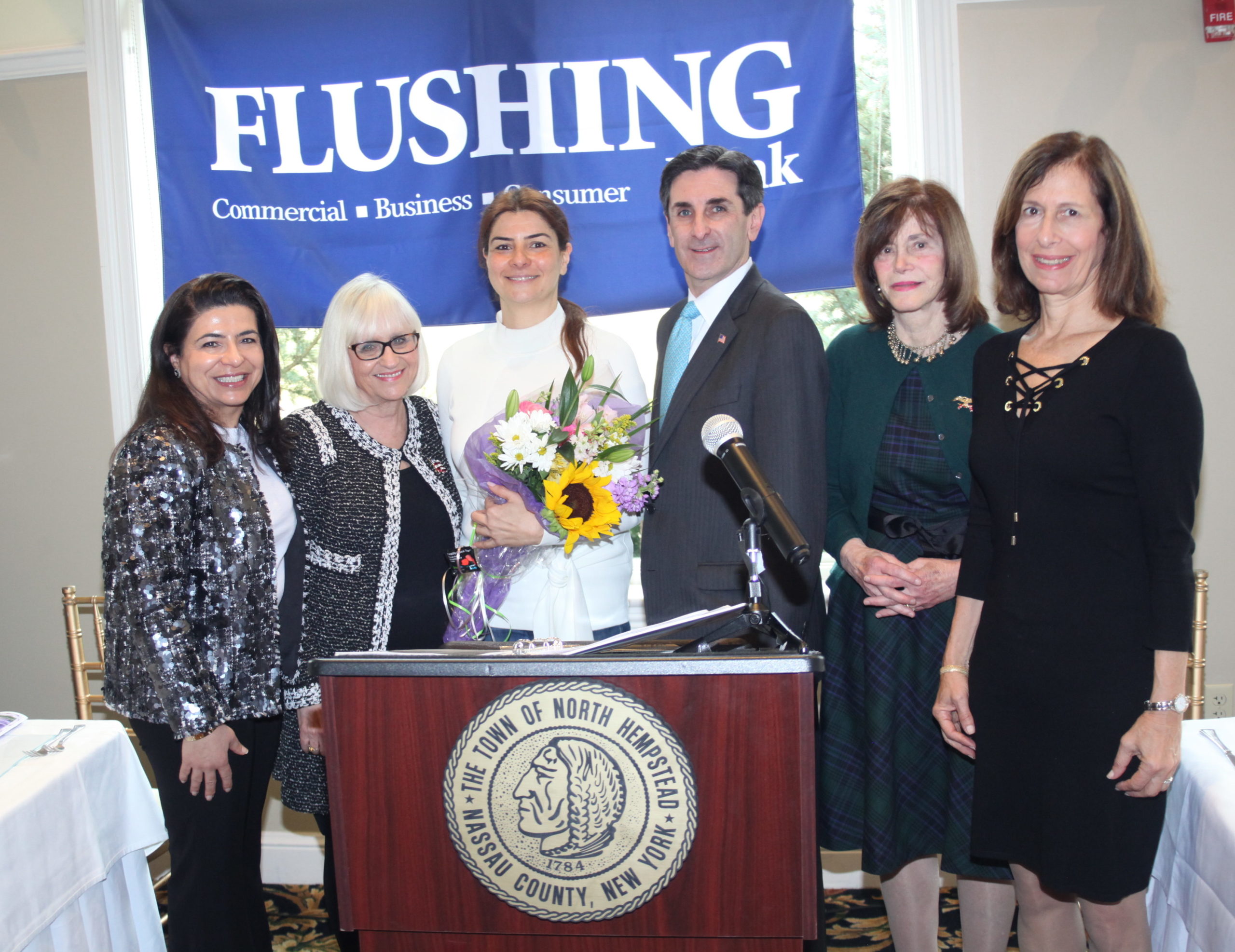 Haleh Benilevi accepts an award from the Town of North Hempstead on behalf of her mother Lida Edalati. (Photo courtesy of the Town of North Hempstead)
