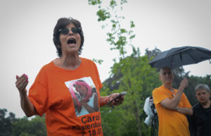 Rita Kestenbaum, wearing a shirt in memory of her daughter Carol, who was killed in 2007 at the University of Arizona, presents a rap to students in attendance about the state of gun violence. (Photo by Janelle Clausen)