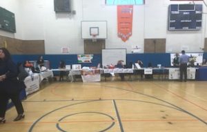 Exhibitors encased the gym of North High School, offering flyers and advice. (Photo courtesy of Claudine Amirian)
