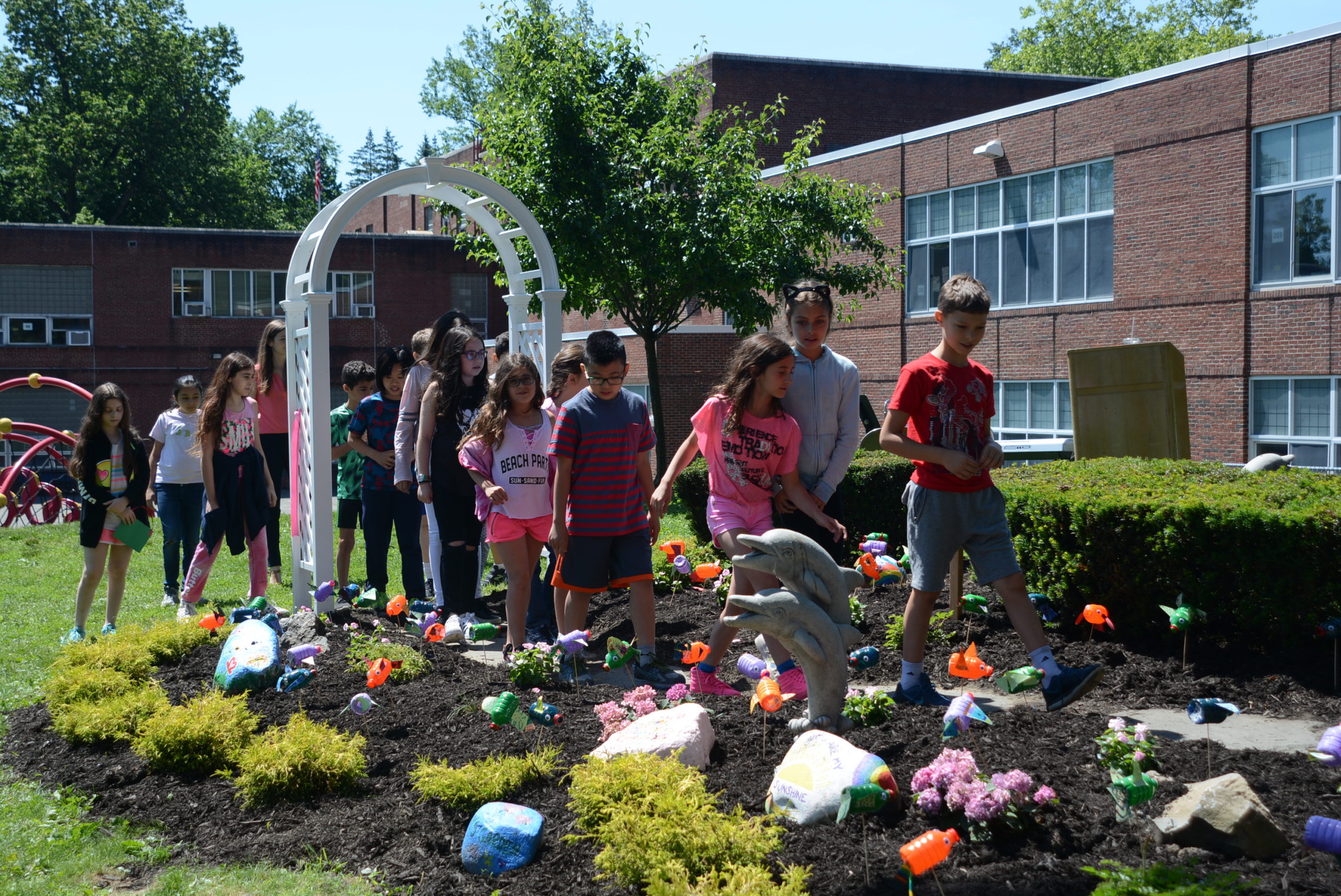 A group of students tour through the newly renovated garden made in honor of Zachary Portnoy, a fourth grader who passed away in 2007. (Photo by Janelle Clausen)