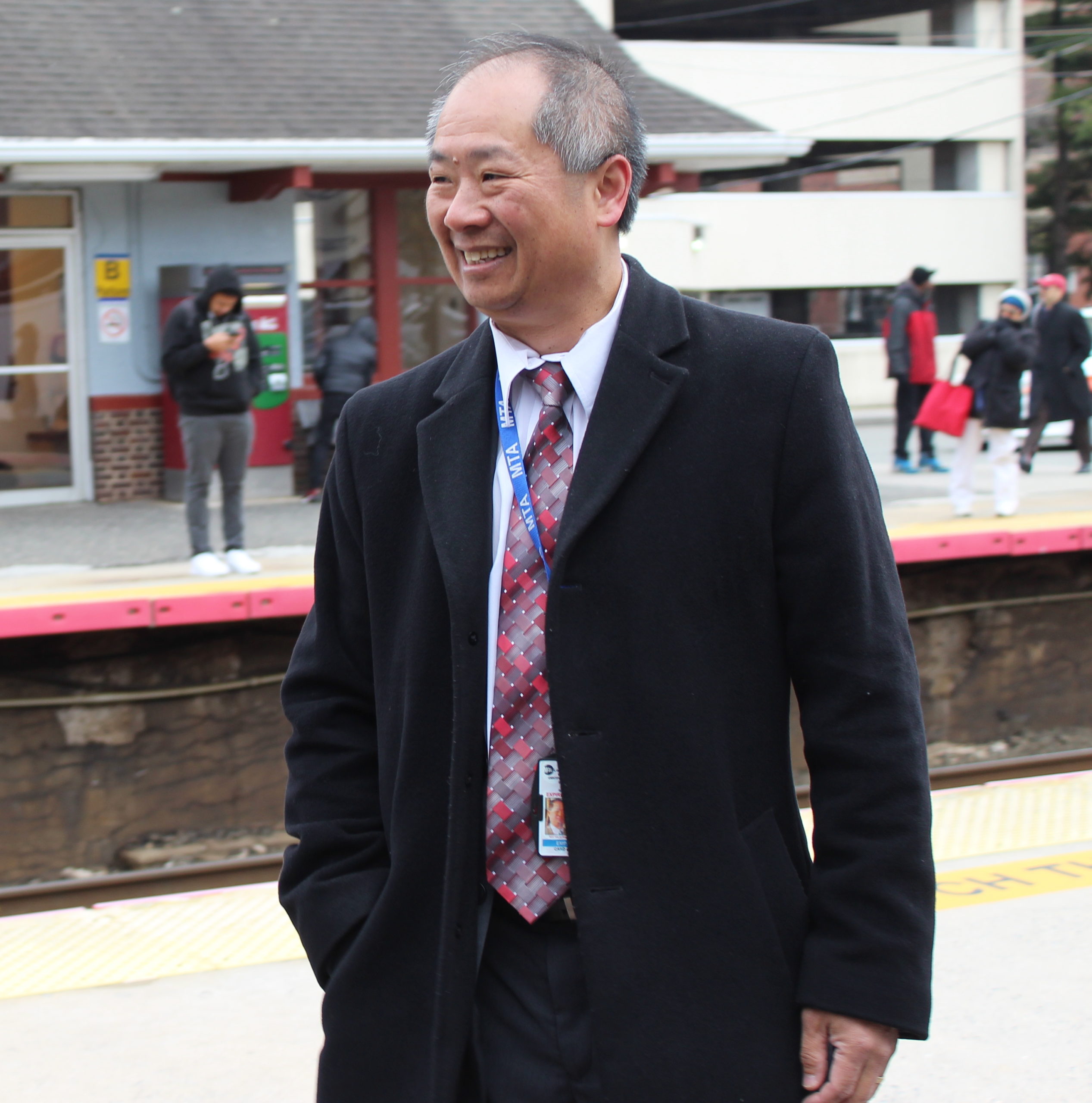 LIRR President Phillip Eng greeting commuters at the Mineola train station. (Photo by Rebecca Klar)