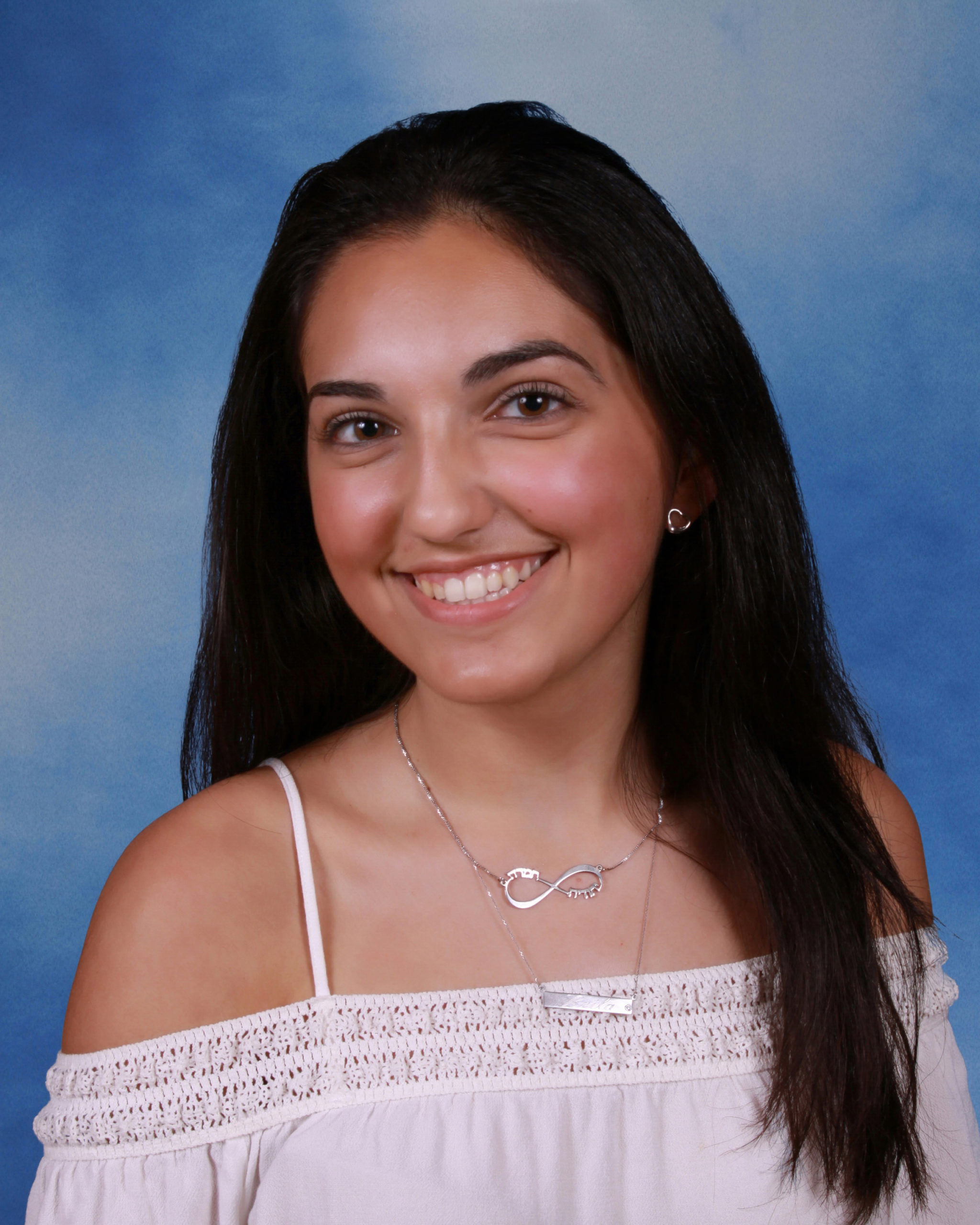Leila Sassouni used the tale of "Humpty Dumpty" to explain overcoming struggle and failures at commencement. (Photo from the Great Neck Public Schools)