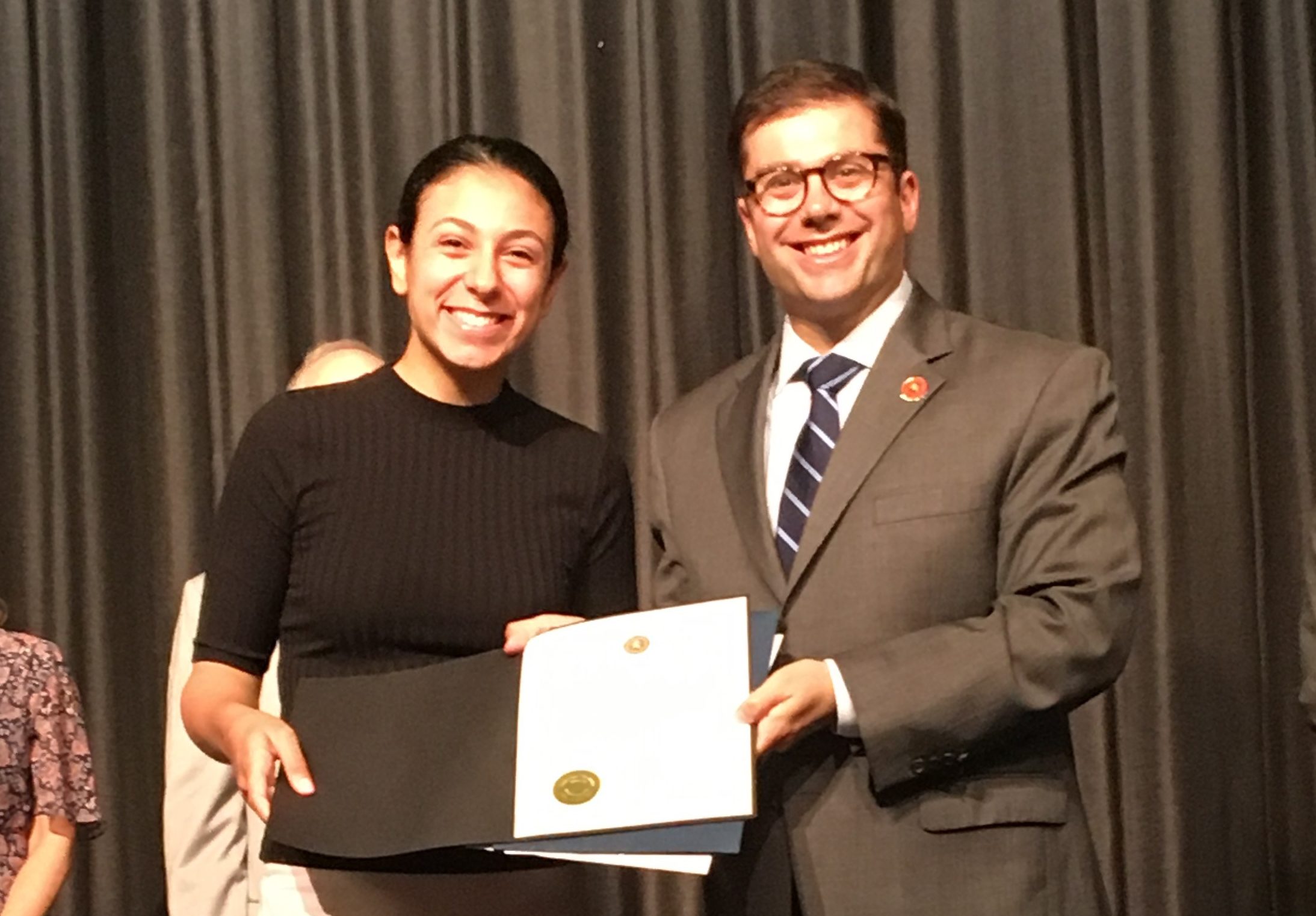 Nassau County Comptroller Jack Schnirman presents the Comptroller’s High School Innovation Award to Rebecca Yaminian at John L. Miller Great Neck North High School. (Photo courtesy of the Comptroller's office)