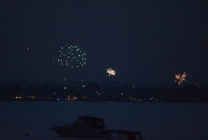 Dozens gathered on the pier to watch fireworks across the water. (Photo by Janelle Clausen)
