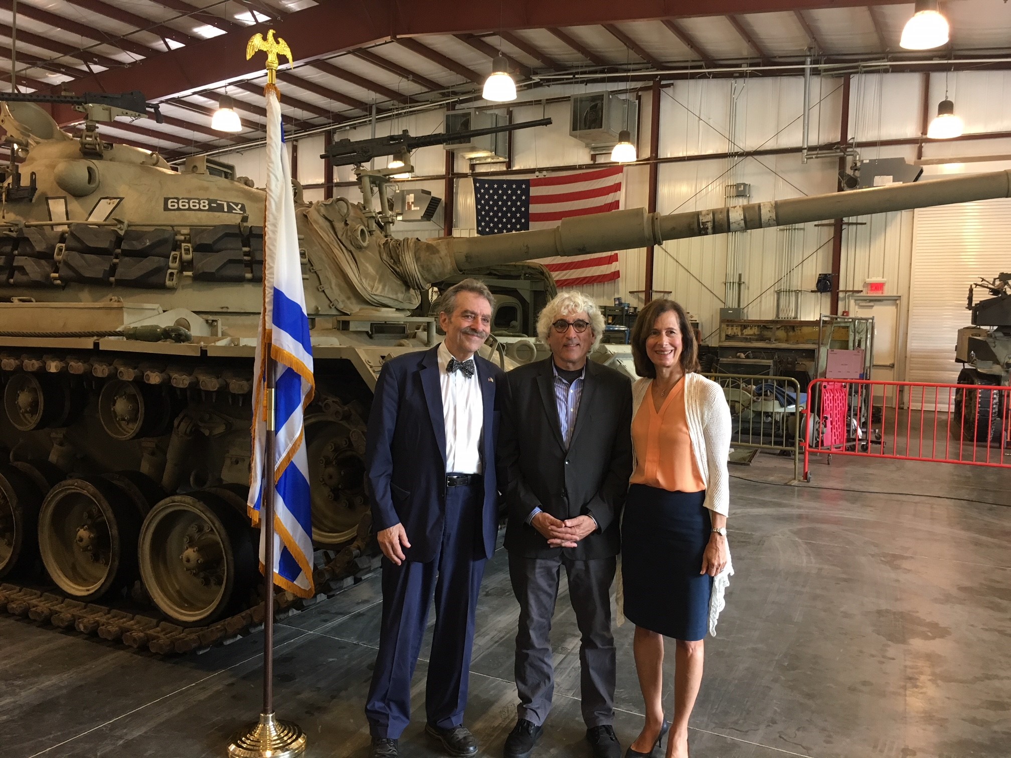 Legislator Ellen Birnbaum, Yuval Neria, and Rabbi Harvey Abramowitz commemorate the 45th anniversary of the Yom Kippur War.