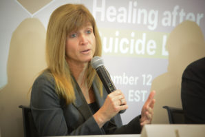 Theresa Buhse of the Long Island Crisis Center highlights suicide warning signs and steps one can take to help someone. (Photo by Janelle Clausen)