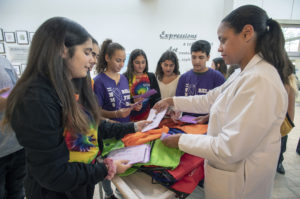 Iris Fleming, RN, nurse manager at Northwell Health’s Cancer Institute, receives thank you notes from eighth graders at Great Neck North Middle School. (Photo courtesy of Northwell Health)