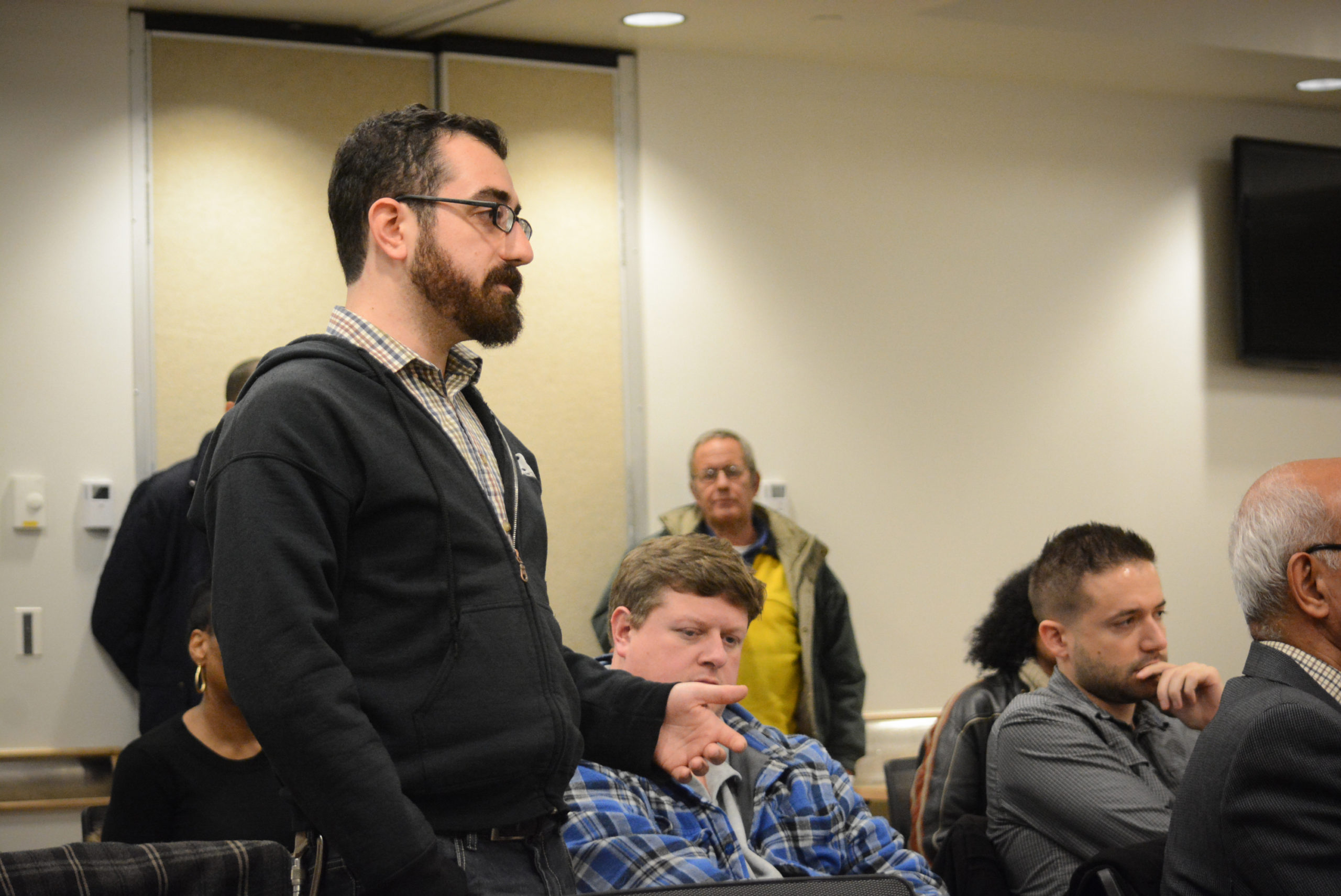 Eliot Friedman, 29, speaks up about issues like healthcare and affordability at the town hall-style forum. (Photo by Janelle Clausen)