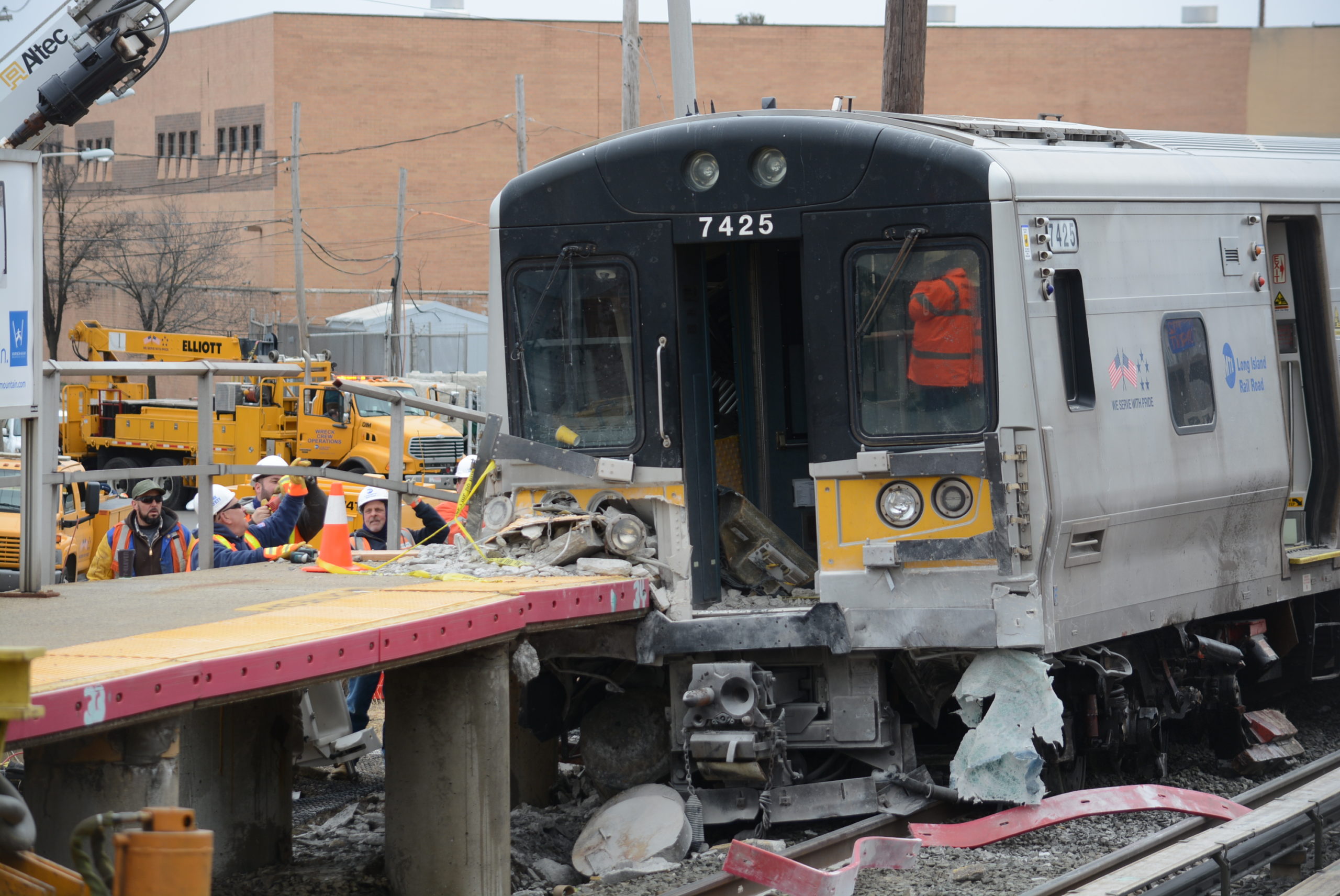 Three people were killed in a fatal crash before this LIRR train derailed and collided with the Westbury train station platform. (Photo by Janelle Clausen)