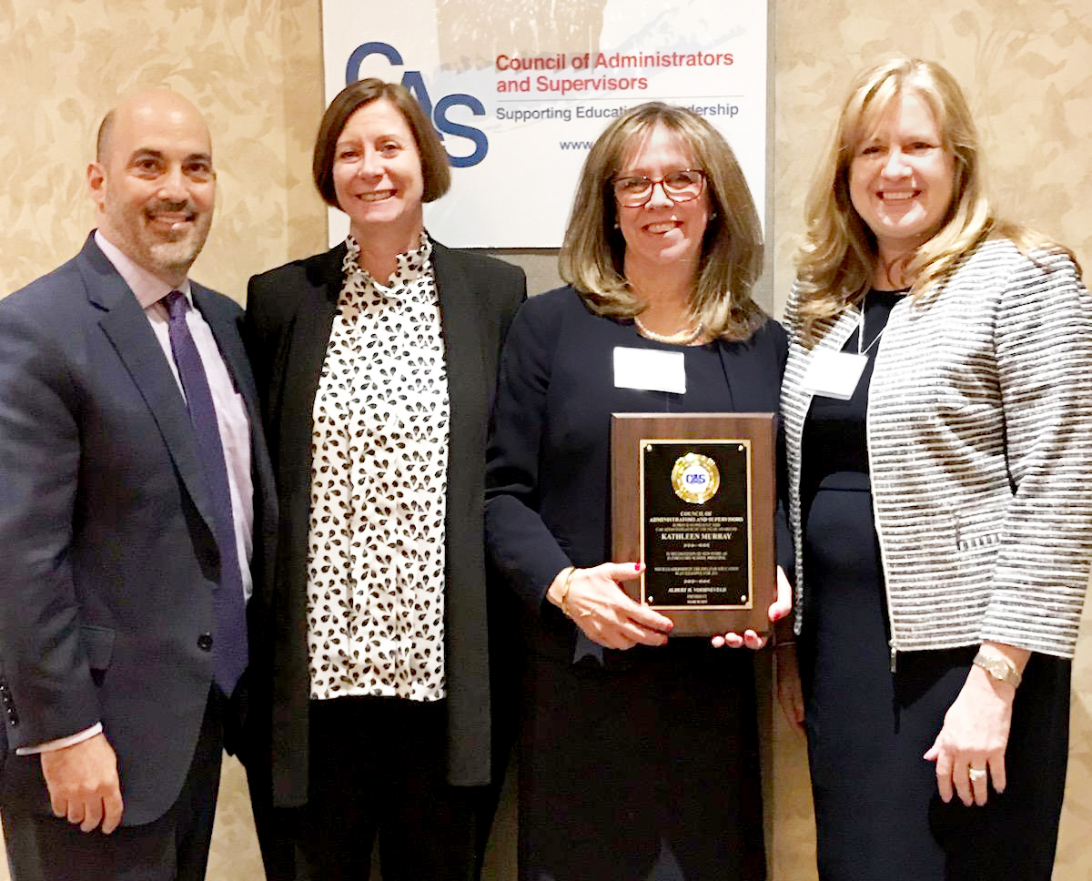 During the 2019 CAS Administrator of the Year awards ceremony, Parkville School Principal Kathleen Murray is congratulated by John F. Kennedy School Principal Ron Gimondo, Assistant Superintendent for Elementary Education Kelly Newman, and Superintendent of Schools Teresa Prendergast. (Photo courtesy of Great Neck Public Schools)