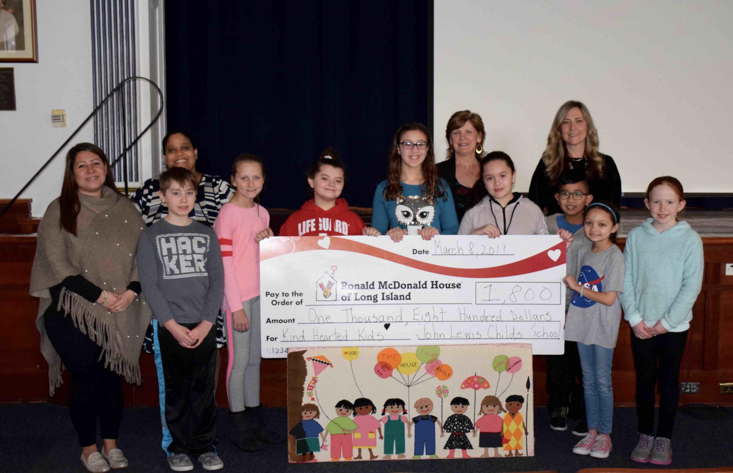 John Lewis Childs School Student Council members are pictured with adviser Kelly Zullo, Principal Susan Fazio and Ronald McDonald House of Long Island Development Manager Jovann Dixon and Hospitality and Event volunteer Joanne Wolfring. (Photo courtesy of the Floral Park-Bellerose School District)