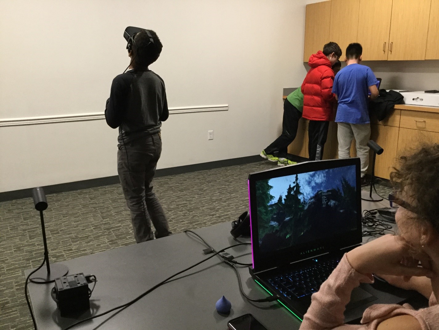 Teens trying out the virtual reality relaxation environment created by Team Dream at Levels. (Photo courtesy of the Great Neck Library)