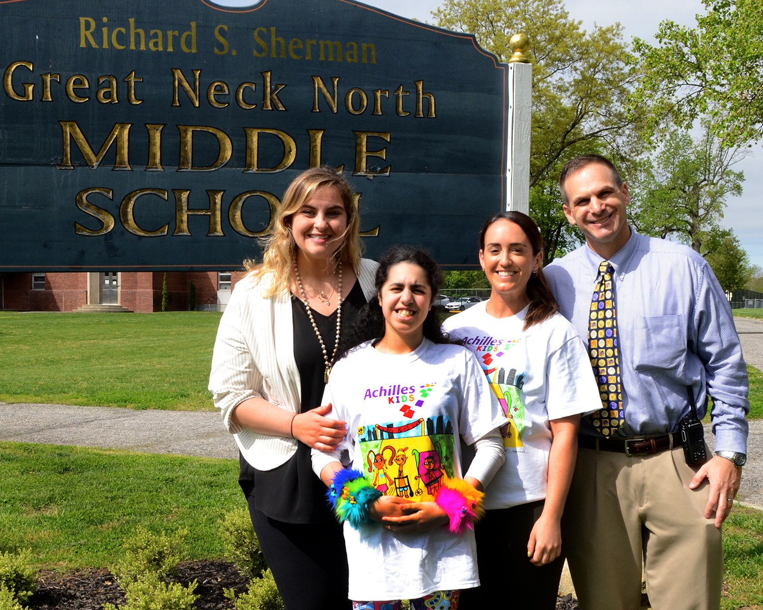 Jewels Rahmanan, wearing her winning t-shirt design for the 2019 Achilles Kids International Program, is photographed with North Middle School teachers Jeryl Lehmuller and Michelle Sicurella, and Principal Gerald Cozine. (Photo by Irwin Mendlinger)