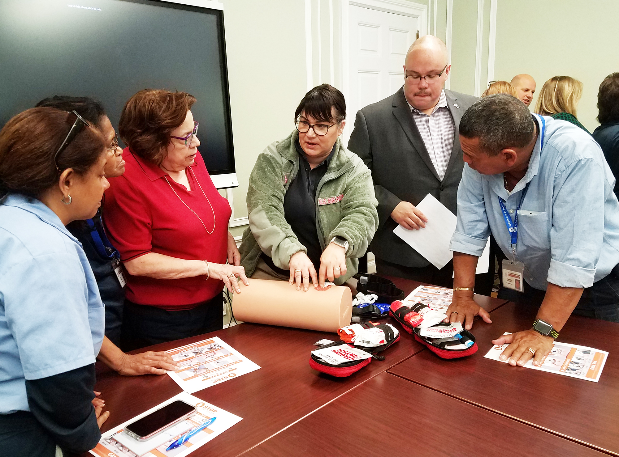 A representative from the Nassau County Fire-Police EMS Academy demonstrates life-saving bleeding control strategies during a recent training workshop as part of the Stop the Bleed initiative. (Photo courtesy of Great Neck Public Schools)