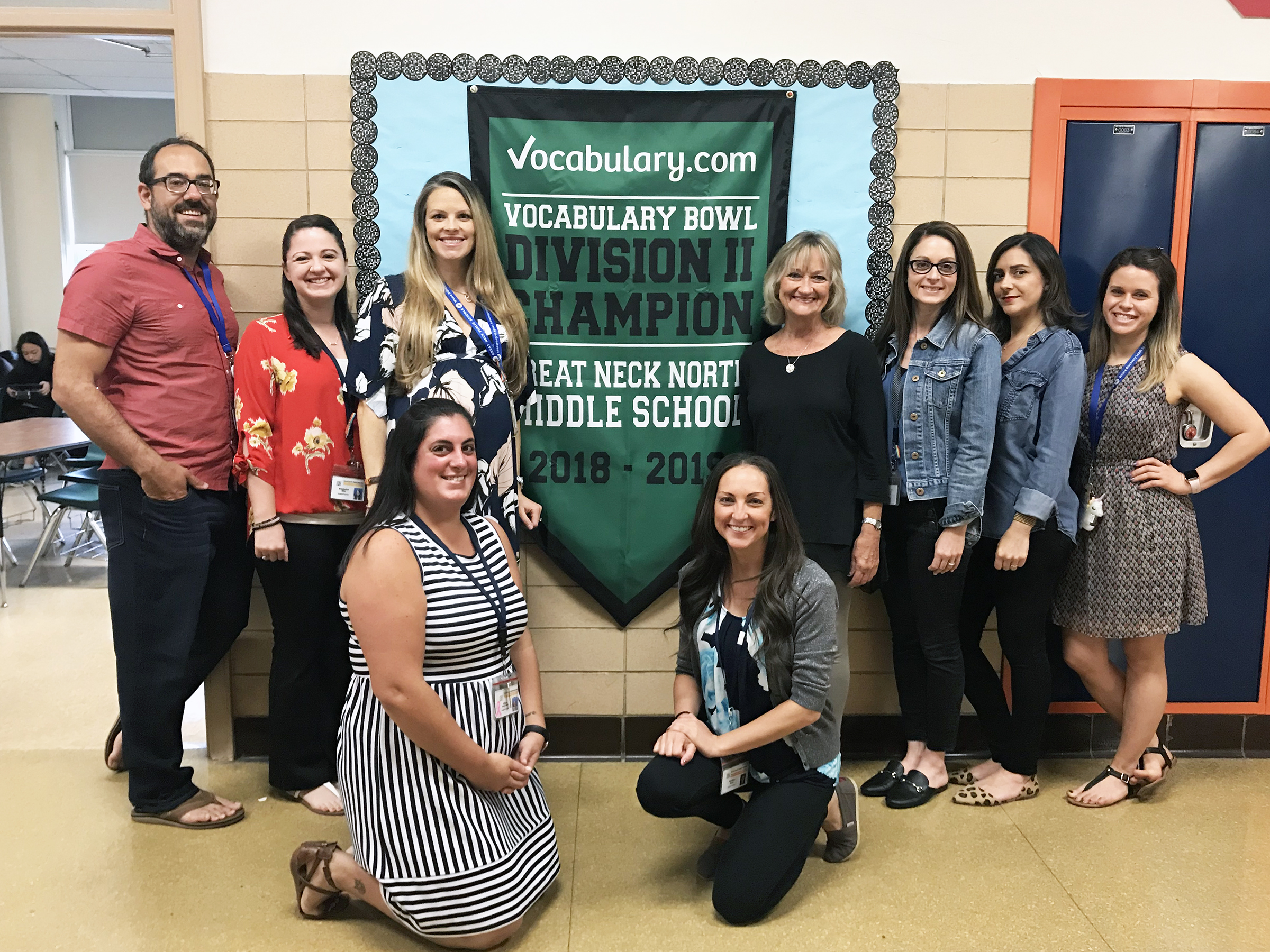 Members of the North Middle English department are photographed with the school’s Vocabulary Bowl championship banner. (Photo courtesy of Great Neck Public Schools)